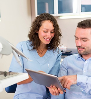 Dentist and patient discussing treatment