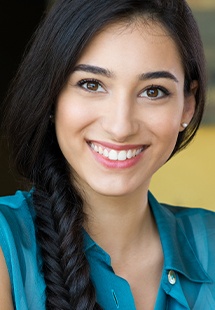 Close up of woman in blue shirt smiling